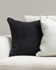A black and a white Baya cyprian cushion in a textural weave