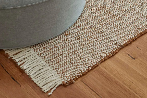 Wool and jute blend floor rug in a warm umber colour, handmade by Globe West and Soren Liv 