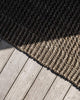The edge of the Broome entrance mat by Baya, showing the differing textures of the dark mat.