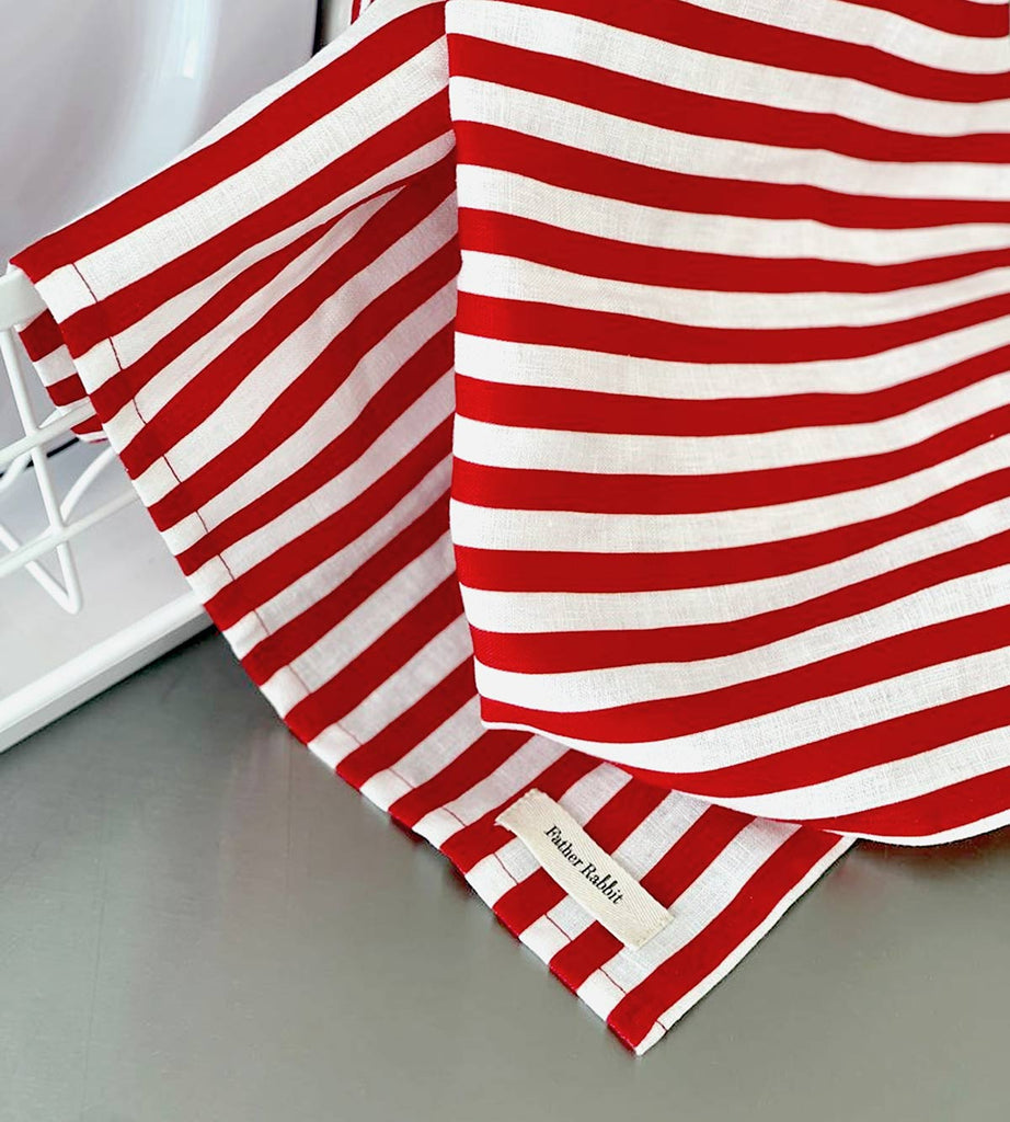 A striped tea towel from Father Rabbit, in the shade French Nautical Red Stripe. The red and white stripes add an element of bright fun to the kitchen.
