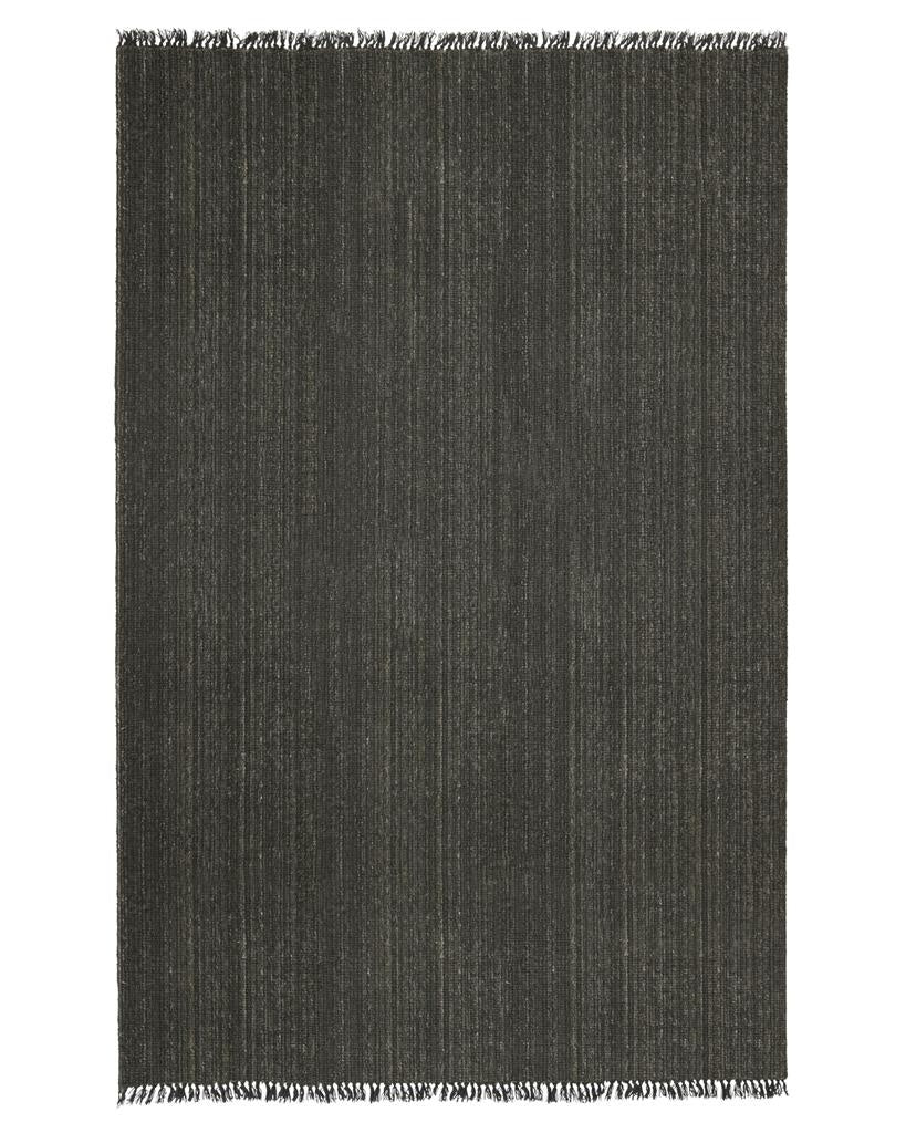 The 'Puglia' floor rug by Weave Home, in colour 'Pigeon" - a deep cool-toned brown, with fringe detail,  seen in full from above.