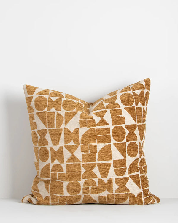 Baya geometric patterned cushion in mustard ochre tones on a cream base
