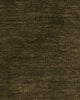 A close up image of the weave of a warm green toned floor runner made with 100% wool. 