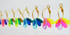 A row of coloourful hoop earrings in various colours, by nz designer Hagen + Co