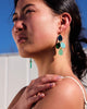 Green dangle earrings byNZ designer Hagen + Co, seen worn by a model