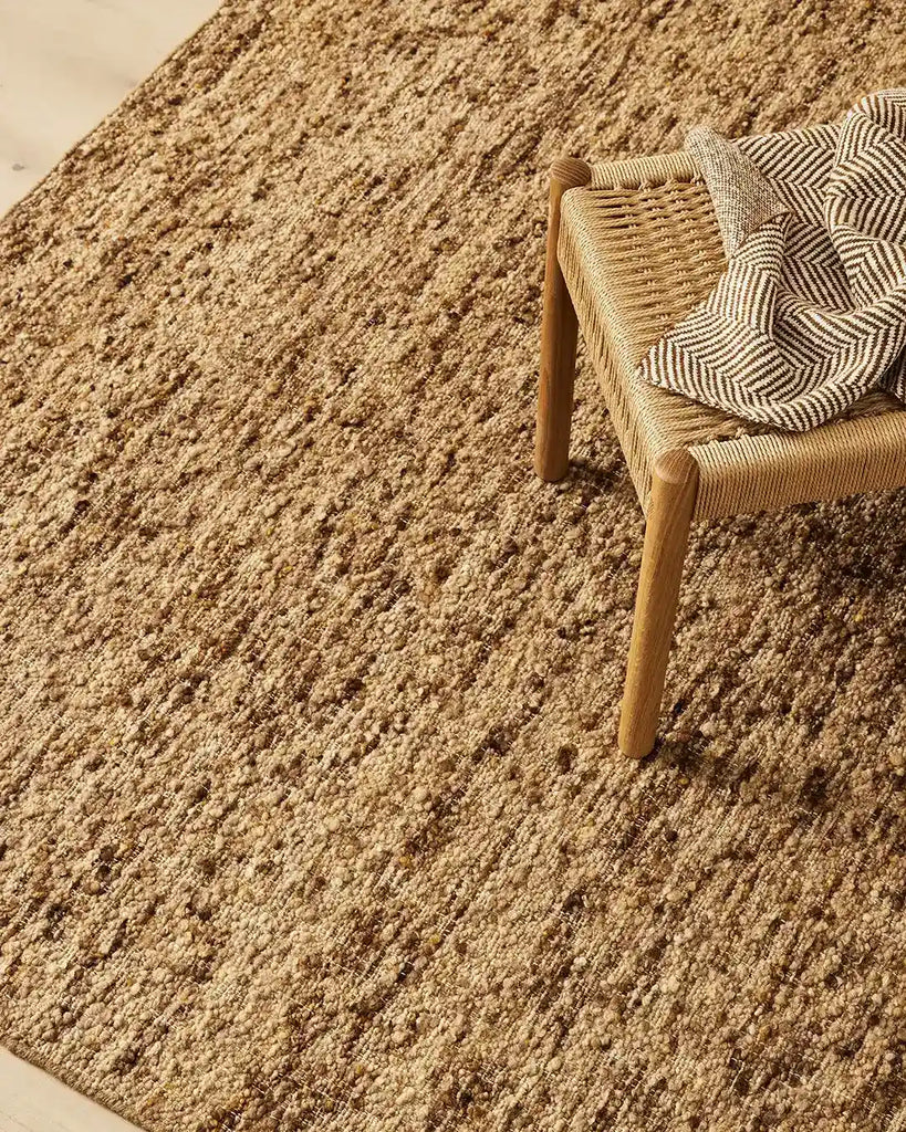 A modern floor rug by Weave Home nz, in  soft shades of brown, with a boucle weave