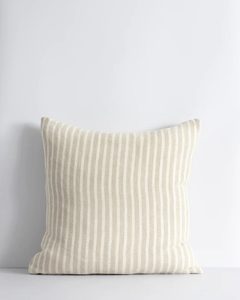 Baya linen cushion featuring a classic Bengal stripe in cream and beige tones 