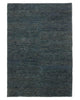 A full image of a muted deep blue-green jute floor rug with dynamic texturing and handwoven detailing. 