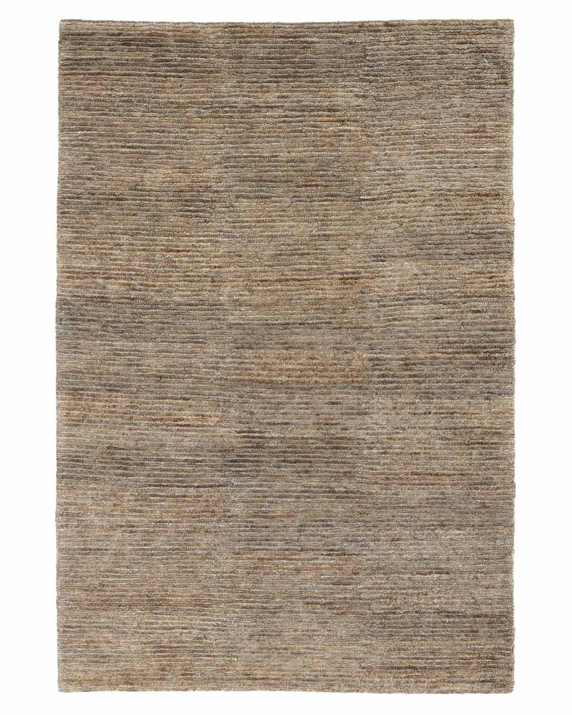 A full image of a cool toned natural jute floor rug with loop and cut texturing. 