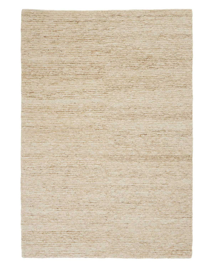 A full image of an off-white beige loop and cut textured jute floor rug. 