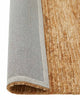 A corner image of a cut and loop pile textured brown floor rug in 100% natural jute with the edge flipped to show the durable cotton backing. 
