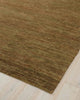 A natural jute olive green toned floor rug with textured loop and cut pile. 