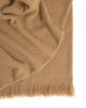 A brown nz wool throw blanket in a boucle weave with fringe detail