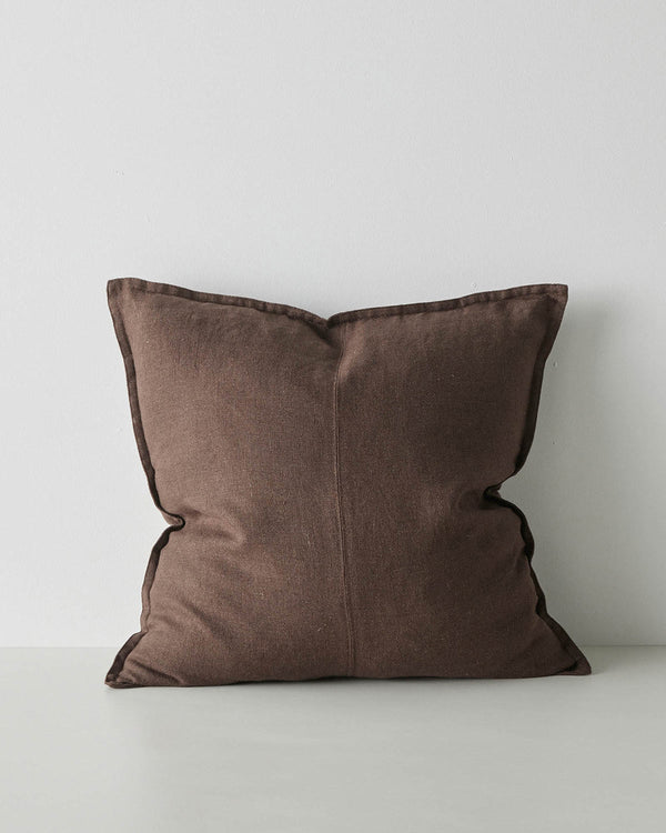A linen cushion in chocolate brown with subtle texturing and a flange edge. 