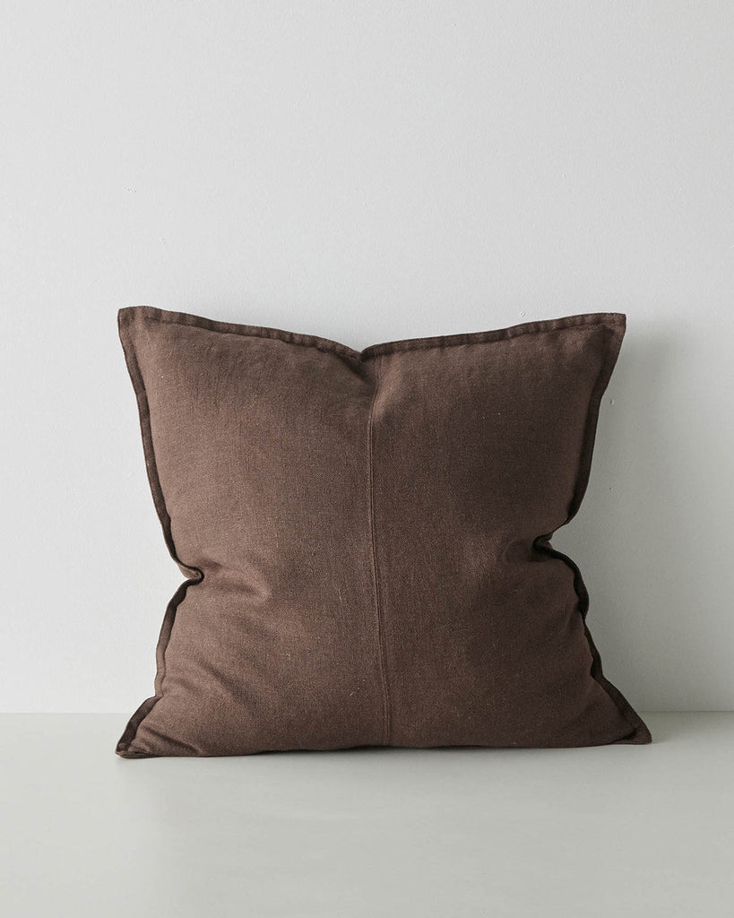 A linen cushion in chocolate brown with subtle texturing and a flange edge. 