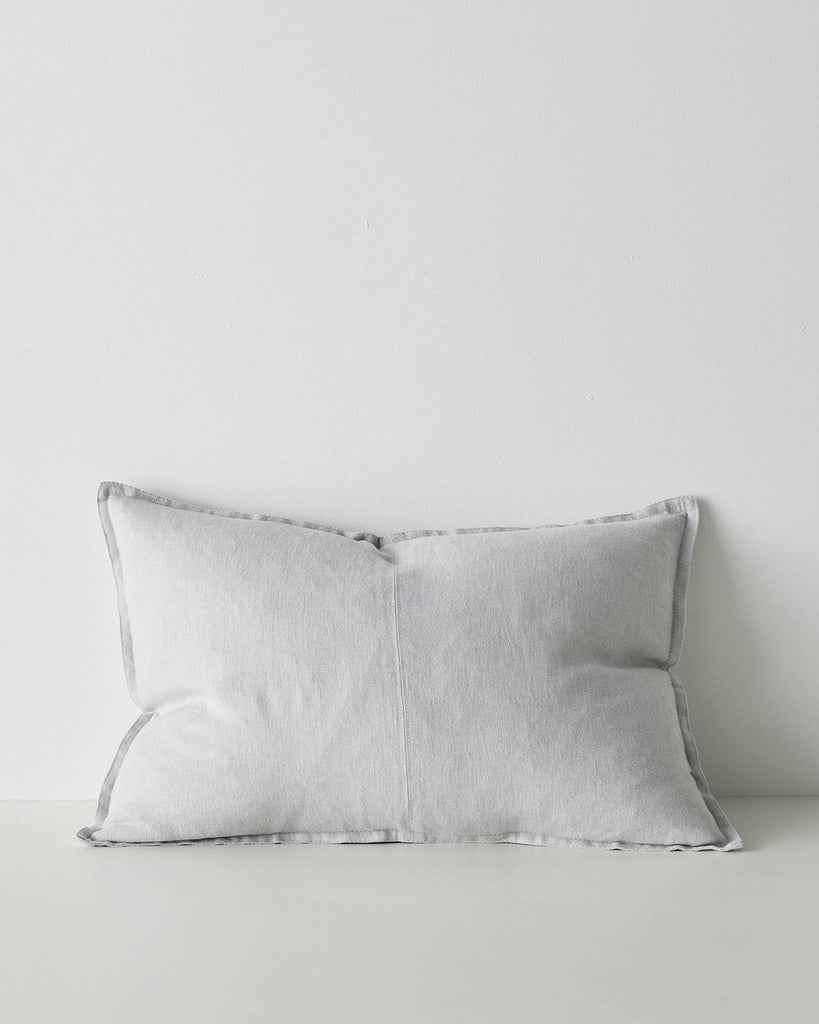 A lumbar cushion with a flange edge and a central seam, made of European linen in a subtle light dove grey. 