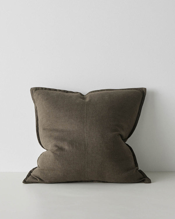 A square linen cushion in an on trend dark  green brown shade with flanged edges and a central seam.