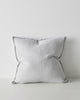 A large Euro style cushion made with linen and with a central seam and flanged edges in a subtle grey tone. 