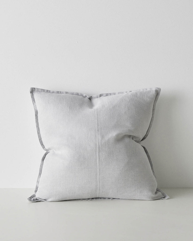 A large Euro style cushion made with linen and with a central seam and flanged edges in a subtle grey tone. 