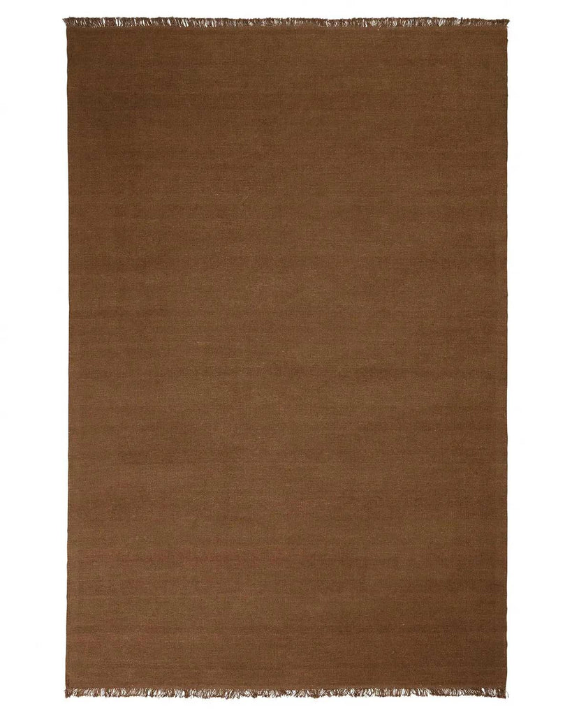 A full image of a warm coffee brown floor rug made of 100% linen with fringe edging. 