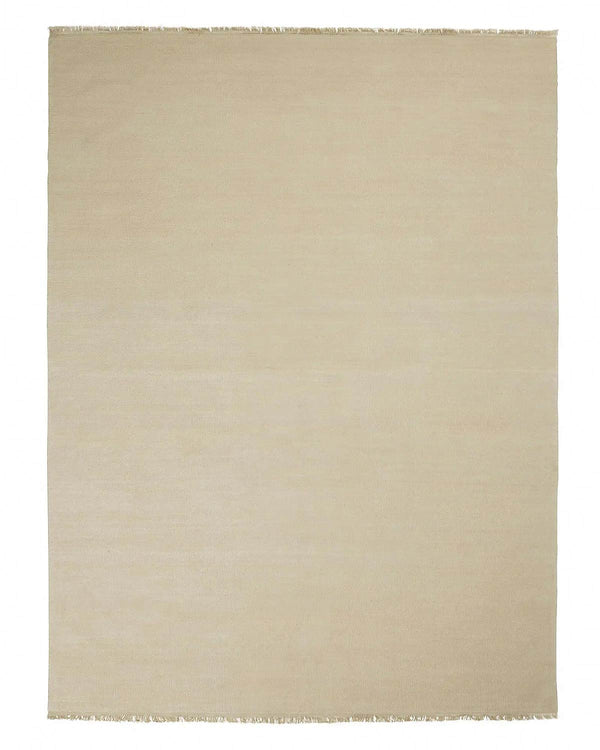 A full image of a handmade cream toned floor rug in 100% linen. 
