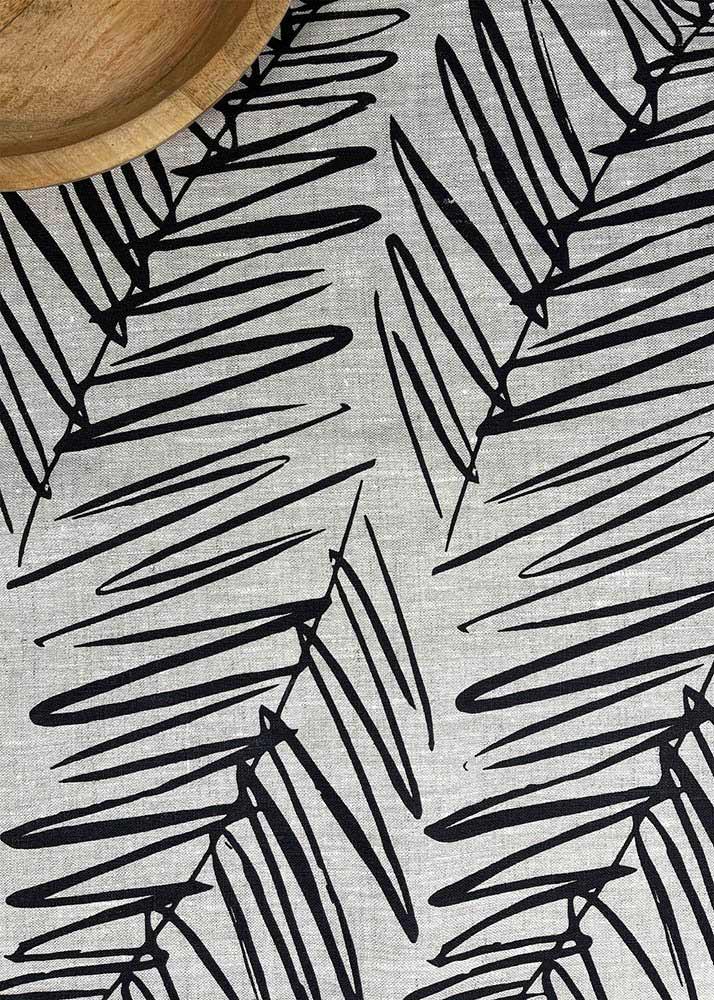 View from above of the handprinted NZ leaf design tea towel black, by Katie Smith of Smitten design