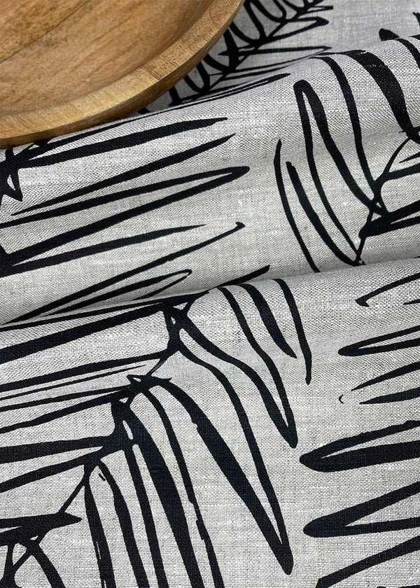 Close up of the handprinted NZ leaf design tea towel black, by Katie Smith of Smitten design