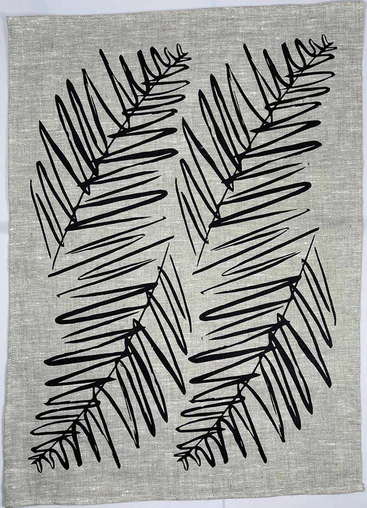 Full view of the handprinted NZ leaf design tea towel black, by Katie Smith of Smitten design