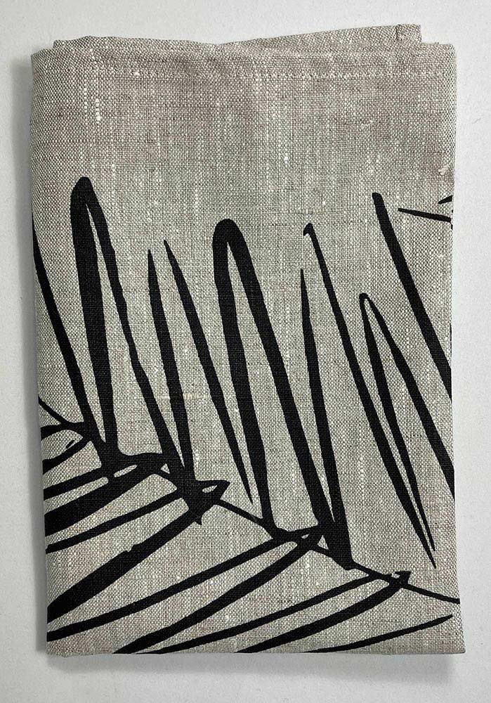 Handprinted NZ leaf design tea towel black, by Katie Smith of Smitten design, folded