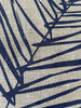 Close up of the handprinted linen teatowel 'Leaf' by Smitten Textile Designs, on natural oat linen