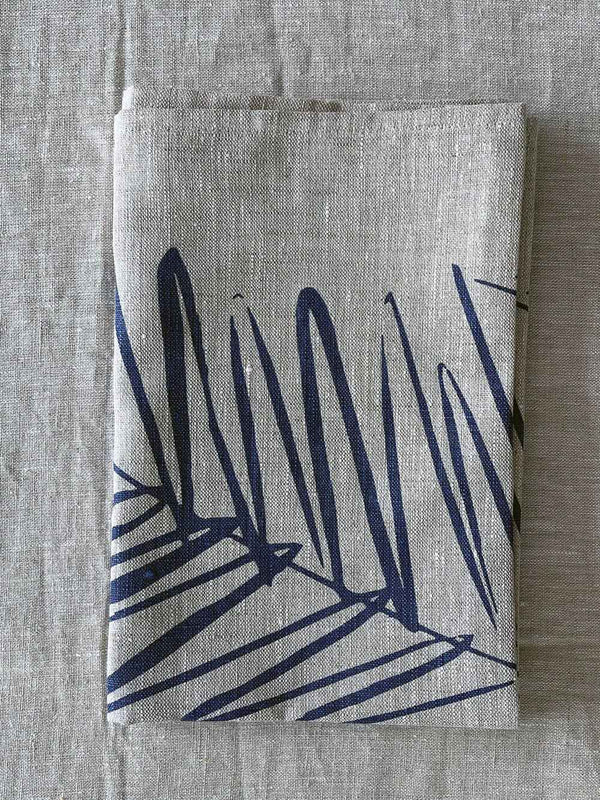 Folded handprinted linen teatowel 'Leaf' by Smitten Textile Designs, on natural oat linen