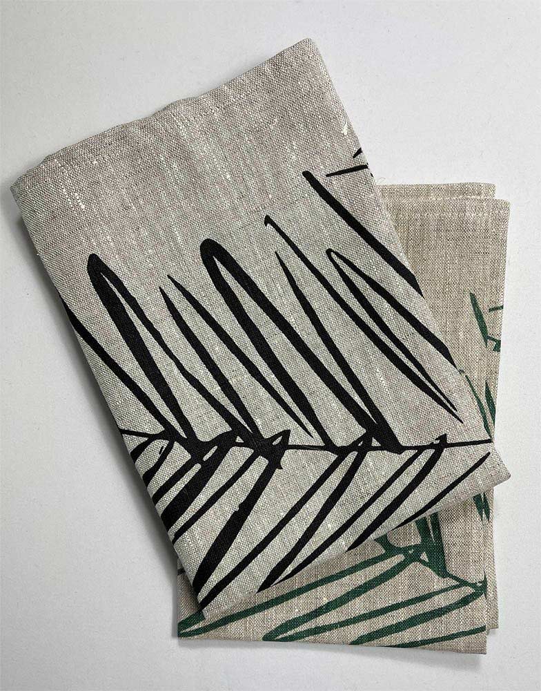 Handprinted NZ leaf design tea towel black, by Katie Smith of Smitten design, folded