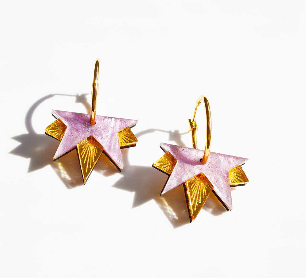 Close up of the Lucky Star acrylic earrings in lilac and gold, by Hagen and Co