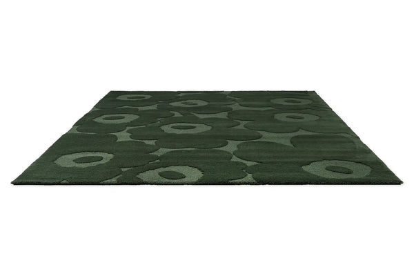 Perspective view of the Marimekko Unikko Dark Green wool floor rug
