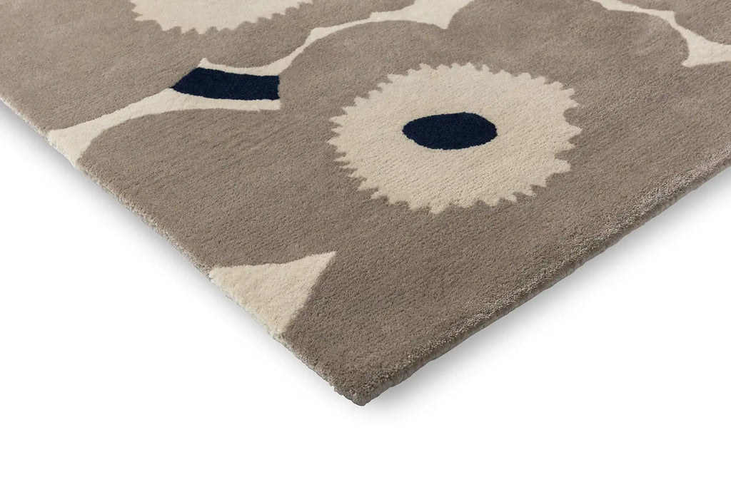 Close up corner view of the Marimekko Unikko wool floor rug in Greige colour