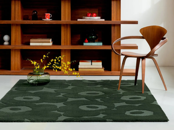 The Marimekko Unikko Dark Green wool floor rug, seen in a modern room