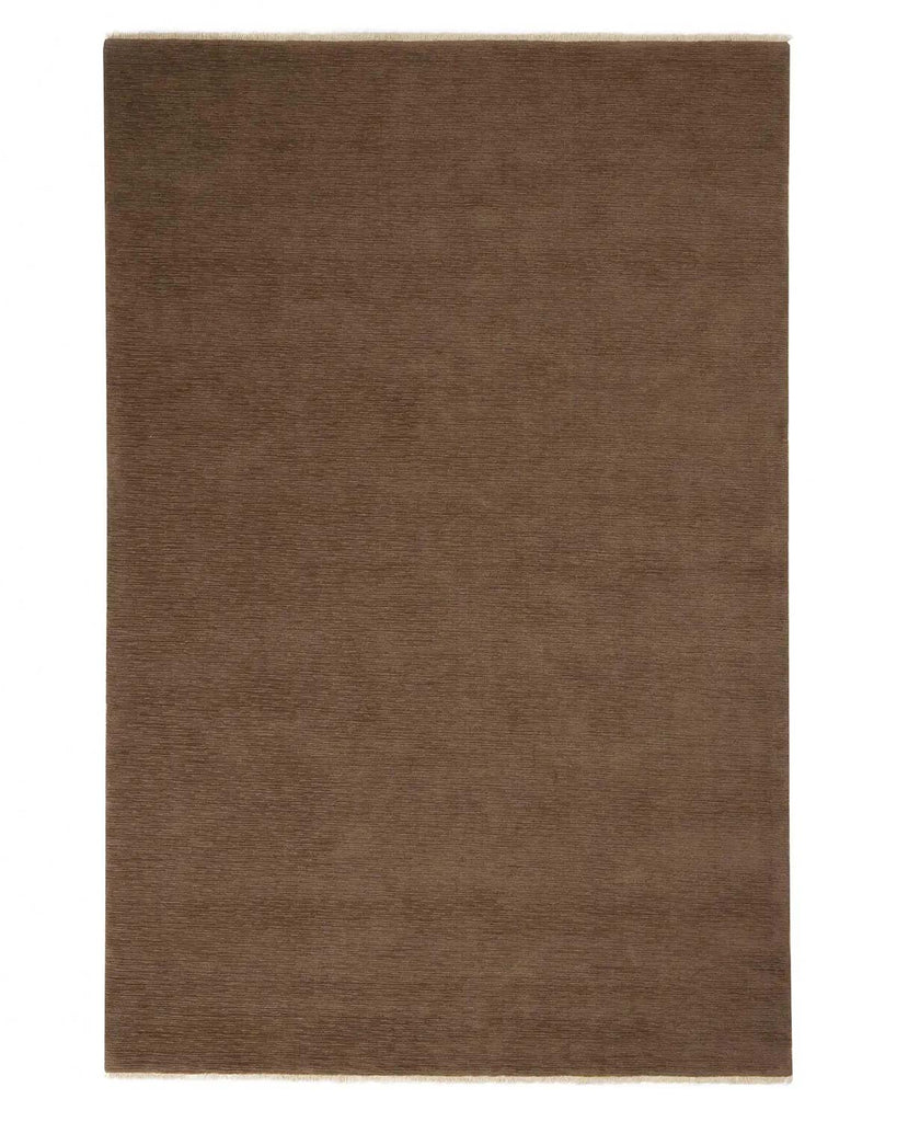 A full view deep taupe 100% NZ wool floor rug with short cream fringed edges and a slight linear quality to the weave. 