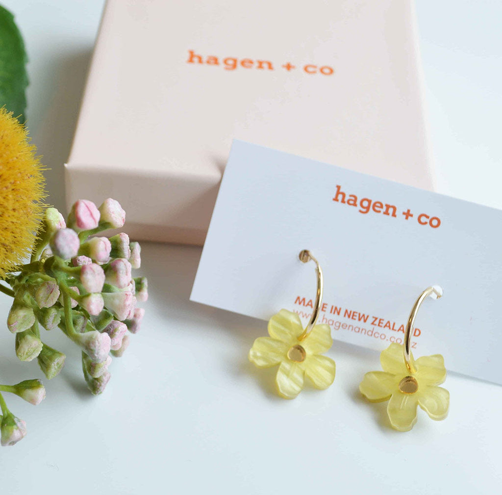 Hagen + Co gift box packaging next to Wildflower earrings  in buttercup yellow