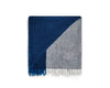 NZ wool throw blanket in blue and white check by Ruanui Station, seen folded with a corner lifted to reveal the check design
