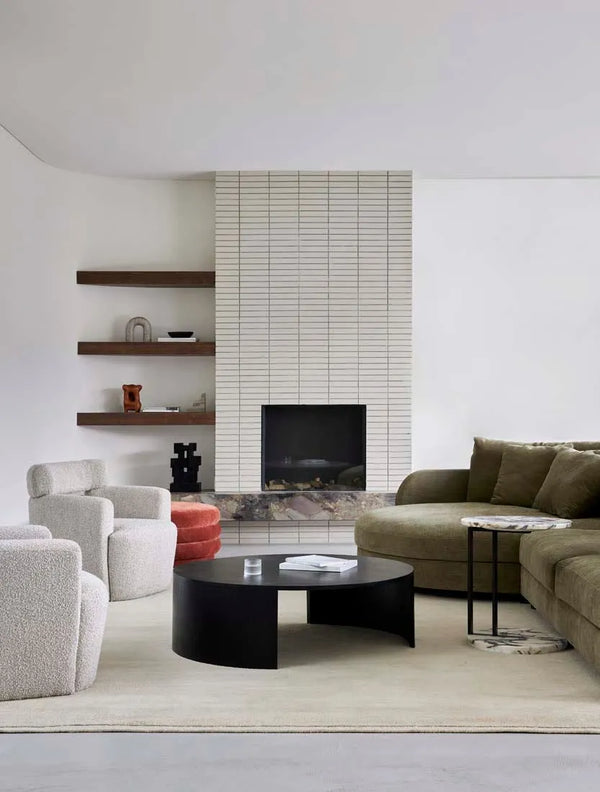 A neutral, wool rug in a natural ecru colour, seen in a modern living room