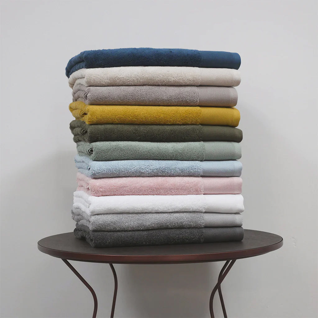 Vida Certified Organic Cotton Towels in a beautiful pile showing all the colour variations