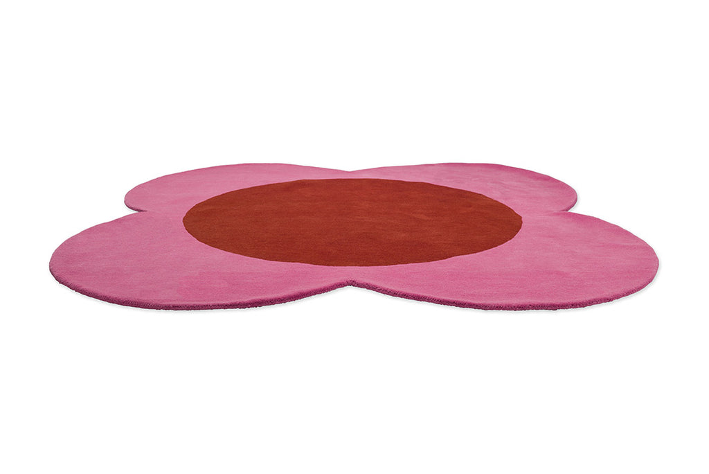The pink and red round spot flower floor rug by Orla Kiely seen in perspective