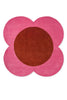 The red and pink round spot flower floor rug by Orla Kiely seen from above