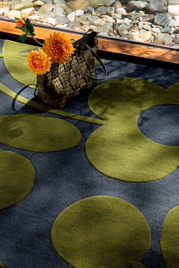 A close up of the Orla Kiely Sprig Stem floor rug in colour 'Marine'  