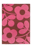 The Orla Kiely Sprig Stem floor rug in colour 'paprika' pink and red, seen full view from above