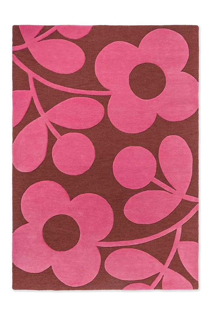 The Orla Kiely Sprig Stem floor rug in colour 'paprika' pink and red, seen full view from above