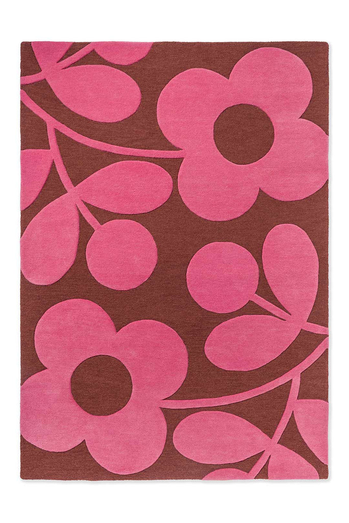 The Orla Kiely Sprig Stem floor rug in colour 'paprika' pink and red, seen full view from above