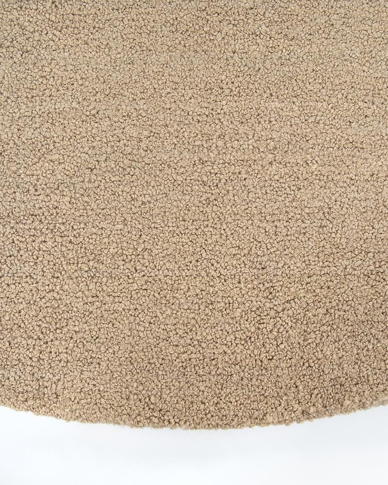 The light brown boucle weave of the Dorset floor rug in 'Biscuit' brown by Baya NZ