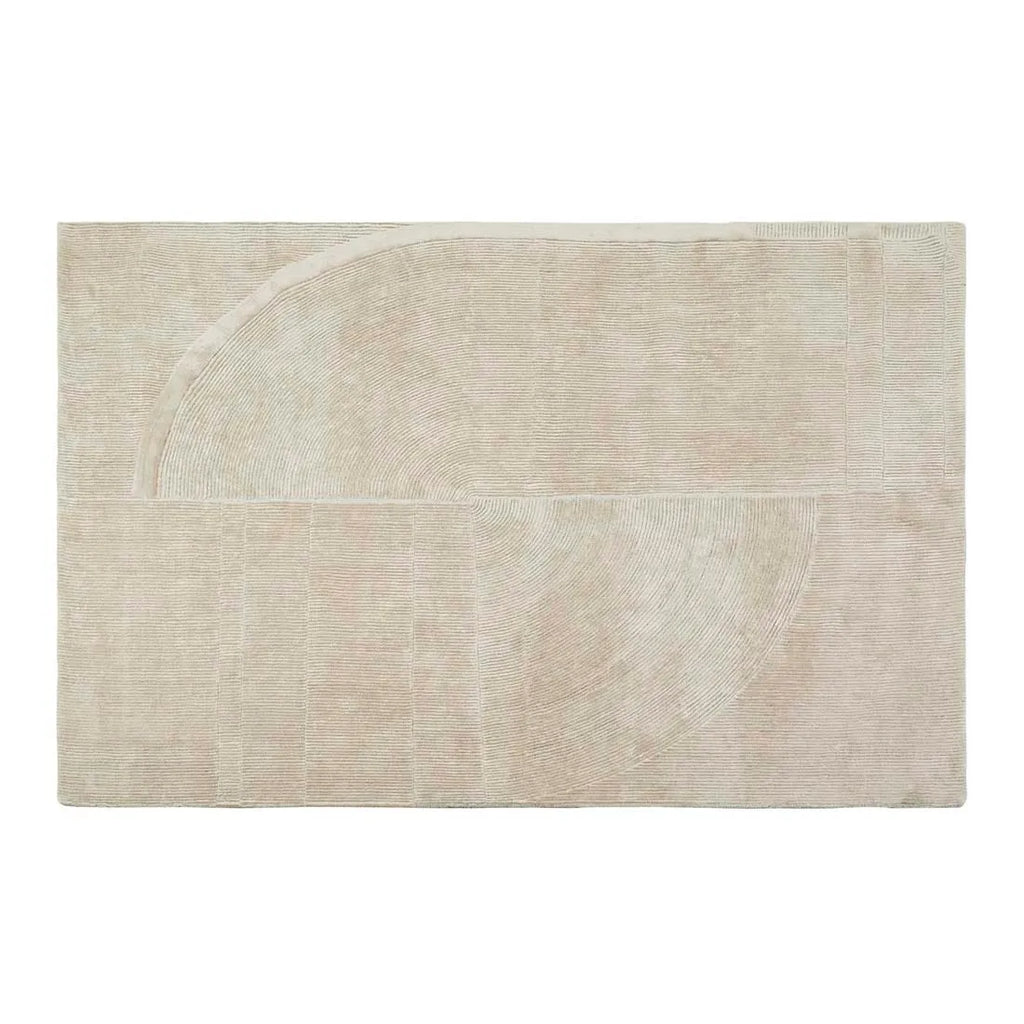 A cream, wool blend rug featuring a circle geometric design