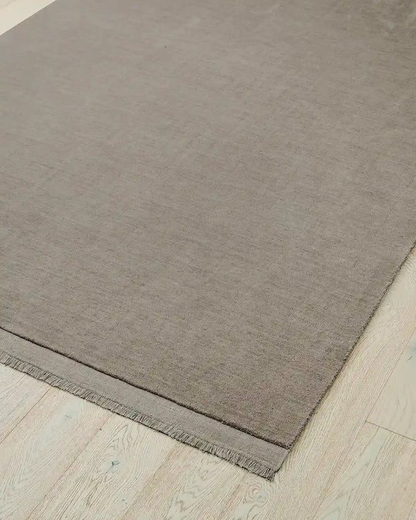 The Silvio wool floor rug, by Weave Home, in grey colour called 'Flint'